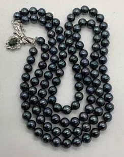 Signed ES Tahitian Pearl 14K Gold Topaz Necklace: Signed ES double strand Tahitian pearl necklace with with 14k gold clasp and topaz gemstone decoration. Deep iridescent blue and purple toned pearls. Signed ES on clasp, marked G 14K on clasp. Drop le