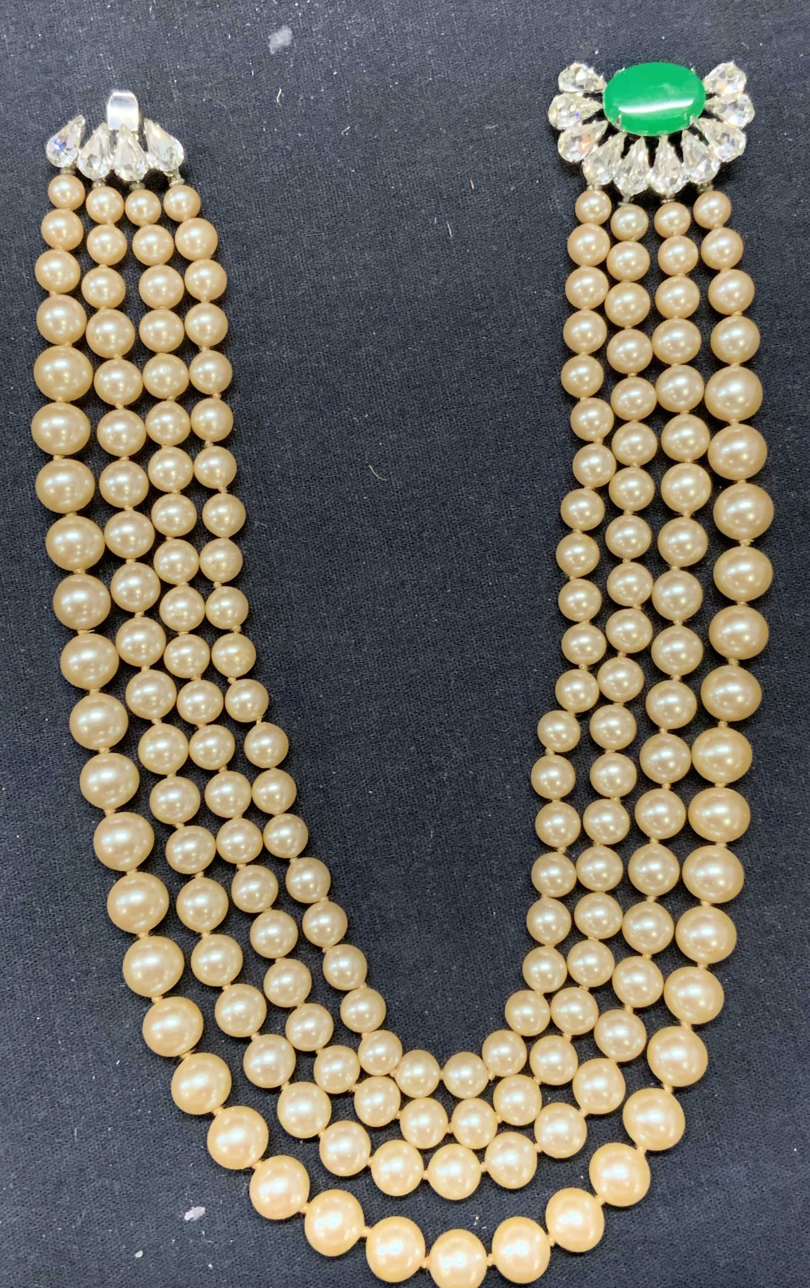 VENDOME Faux Pearl Crystal Necklace: Vintage Vendome multi strand faux pearl necklace with colorless and green crystal clasp. Signed to clasp. Drop length of shortest strand approx. 5.5 inches. Piece has weight. Some surface wear includi