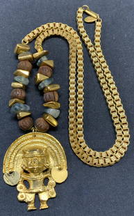 MIRIAM HASKELL Aztec Figural Pendant Necklace: Vintsge Miriam Haskell gold plated necklace Aztec figural pendant, wood and glass beads. Signed on necklace hangtag. Drop length approx. 14 inches. Pendant measures approx. 2 x 1.75 inches. Some surfa