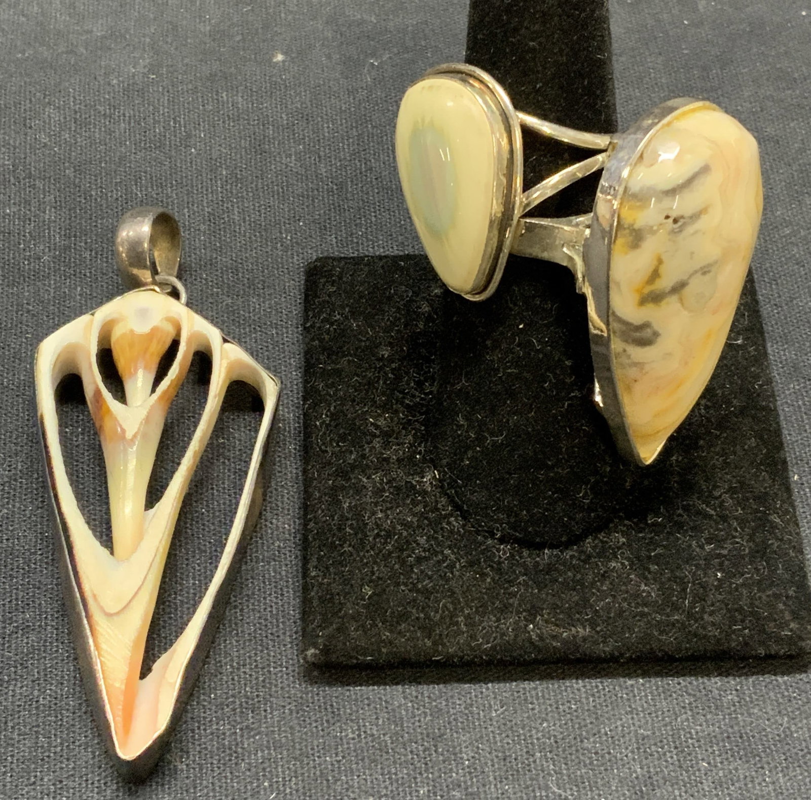 3 Sterling Silver Agate Ring & Bone Pendant, More: Lot of 3 jewelry pieces. Sterling silver and agate gemstone ring. Marked 925 to interior band. Ring size 9.5. Silver tone ring with agate gemstone. Ring size 6.75. Gemstone measures approx. 1 3/8 x .7