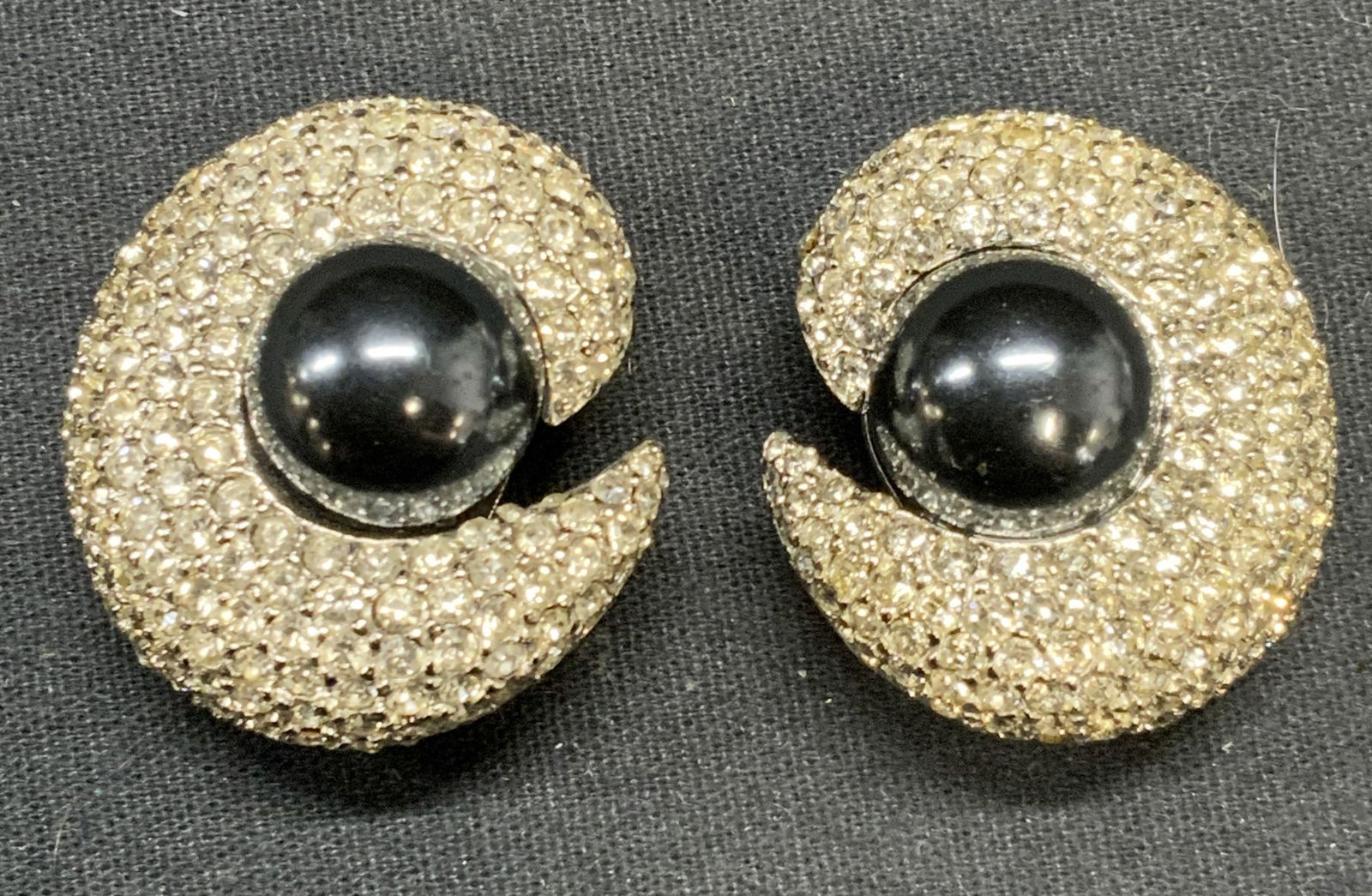 CINER Silver Tone Faux Pearl Crystal Earrings: Vintage CINER silver tone faux Tahitian pearl and colorless crystal decorated clip on earrings. Signed to backings. Measures approx. 1.25 inches diameter. Some scratching observed. Estate jewelry, cos