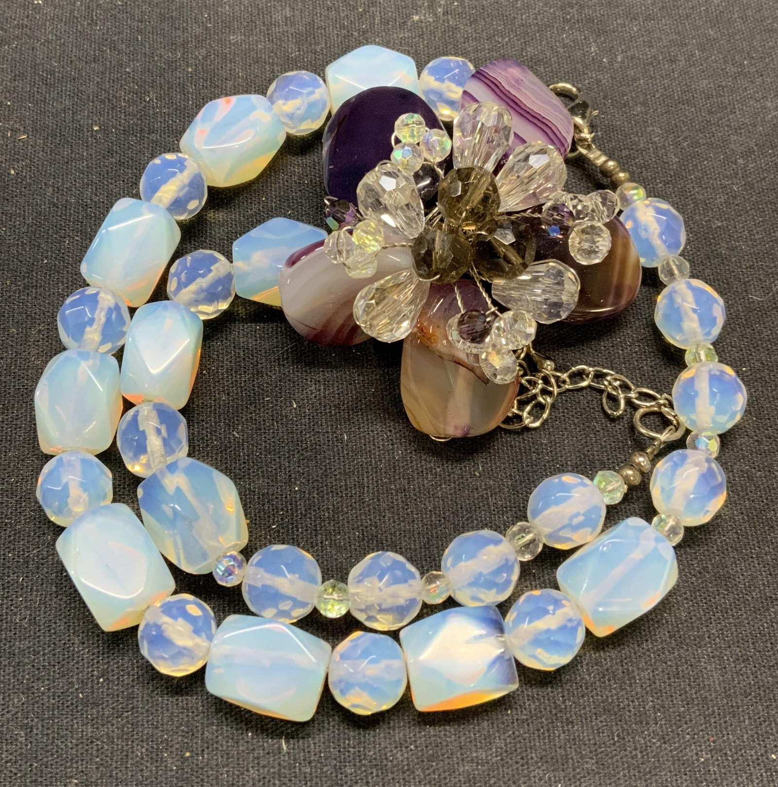 Opalescent Crystal Beaded Flower Pendant Necklace: Vintage opalescent crystal and glass beaded necklace with floral pendant. Drop length approx. 9.5 inches. Pendant measures approx. 1.75 inches diameter. Some surface wear including scratching observed