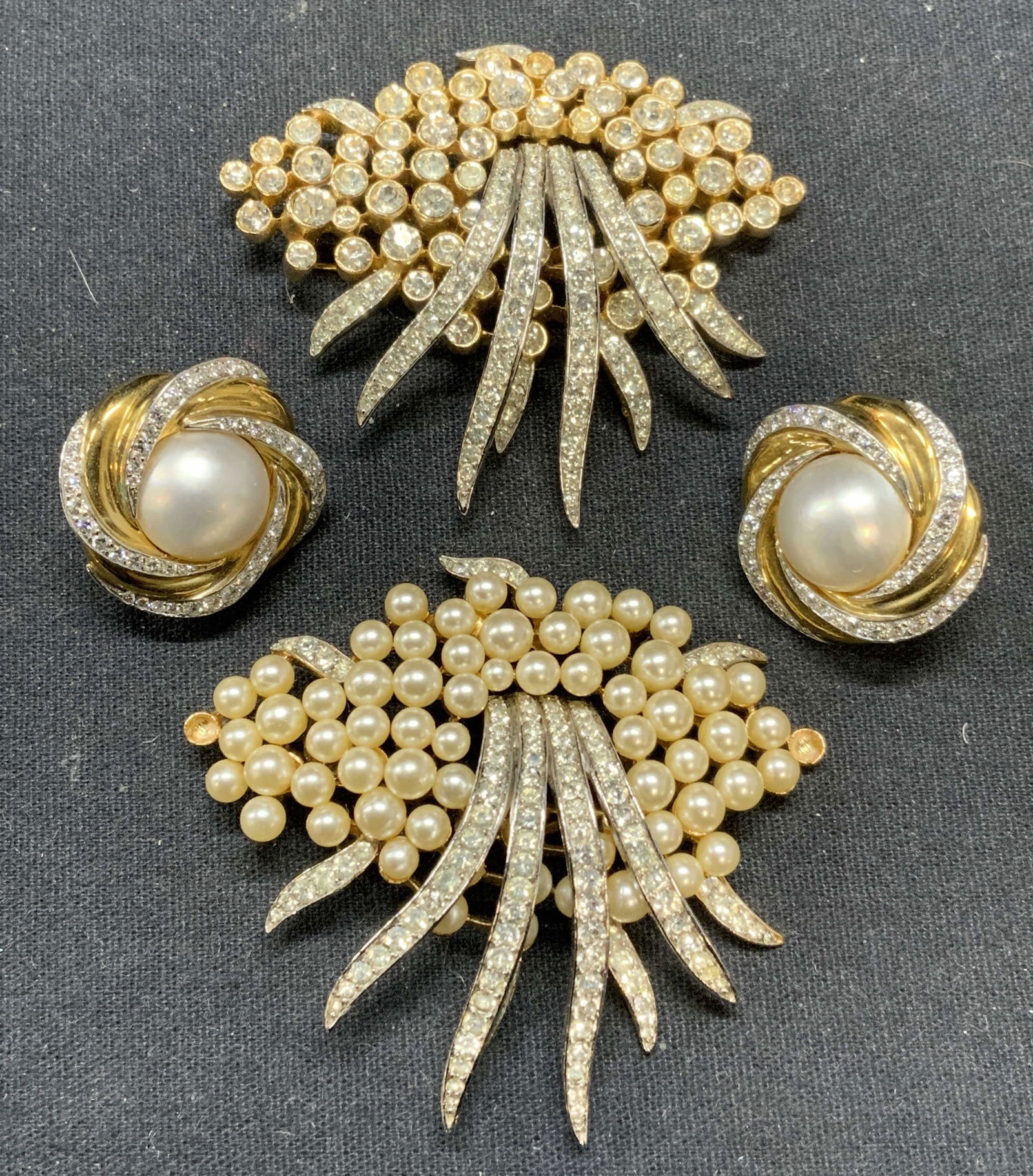 3 TRIFARI Faux Pearl & Crystal Brooches, More: Lot of 3 jewelry pieces. Vintage Trifari gold tone faux pearl and crystal decorated brooch and gold tone crystal decorated brooch with matching silhouettes. Both pieces signed to undersides. Hinge pin