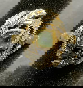 Signed 18K Gold & Diamond Ring: Signed 18k gold ring with diamond halo and green crystal at center setting. Hallmarked with star, marked 750, stamped 71 with diamond. One diamond needs replacement on halo. Ring size 6.5. Setting mea