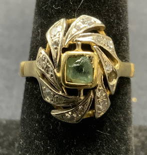 Signed 18K Gold & Diamond Ring: Signed 18k gold ring with diamond halo and green crystal at center setting. Hallmarked with star, marked 750, stamped 71 with diamond. One diamond needs replacement on halo. Ring size 6.5. Setting mea