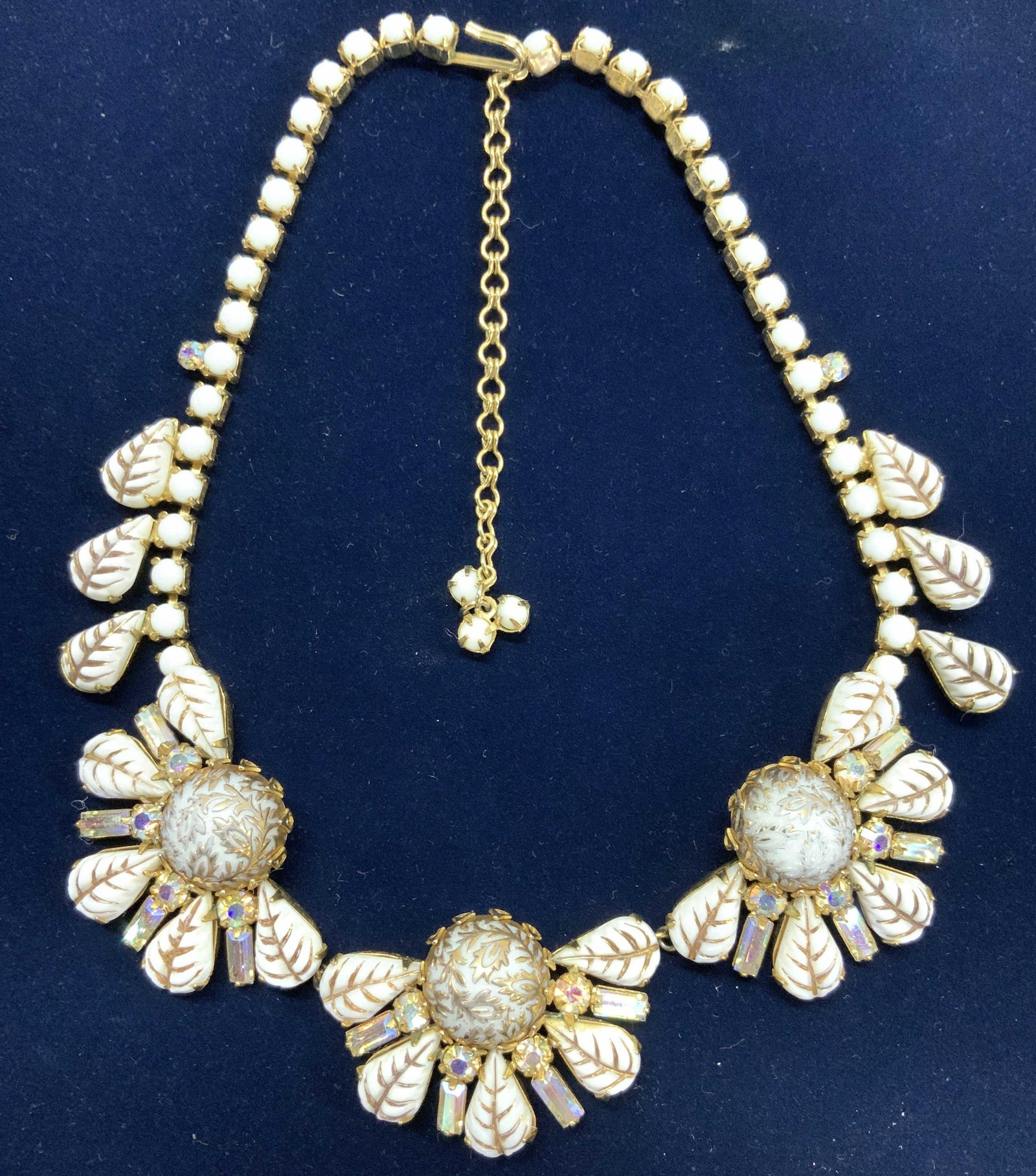 Hobe Retro Style Regency Necklace: Hobe chocker necklace with white and gold beads creating a flower design.Necklace drop is 5.5 in. Total length 16 in. Adjustable length with hook clasp. Flower design measures 5 x 1.25 in. Signed Hobe