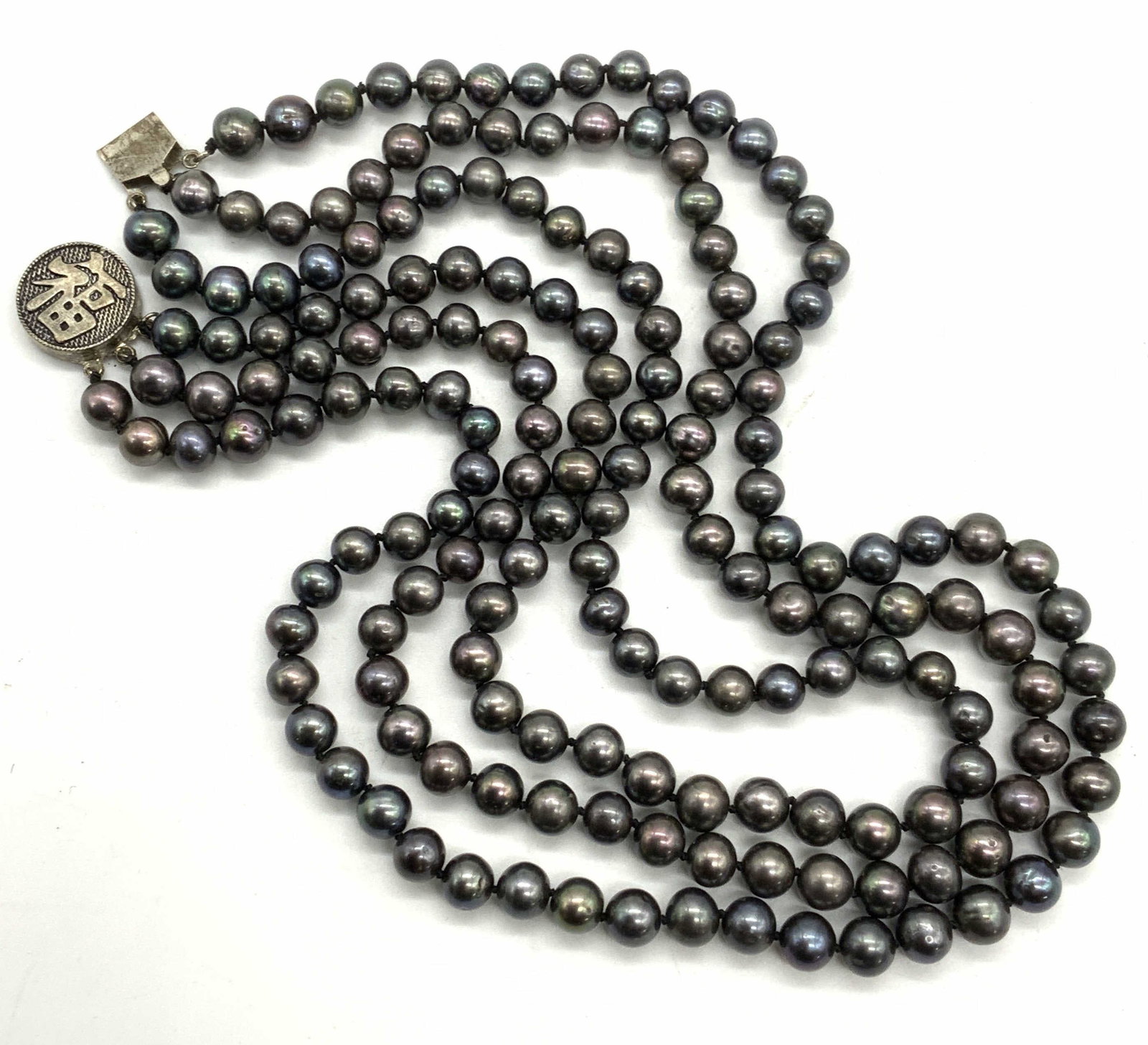 Signed Asian 3 Strand Tahitian Pearl Necklace: Vintage signed Asian 3 strand purple and blue toned Tahitian pearl necklace with sterling silver clasp. Signed on clasp, marked 925. Drop length approx. 7 inches. Total weight 433 carats. Some scratch
