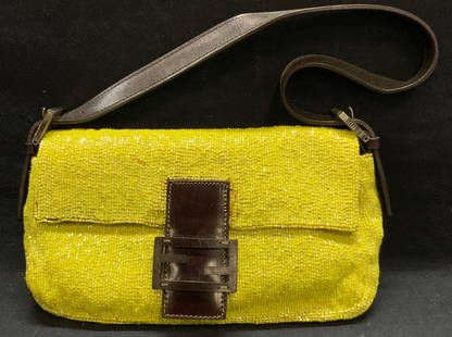 FENDI Yellow Beaded Baguette Handbag, Italy: FENDI yellow beaded baguette handbag. Brown leather trim and wood FENDI logo hardware. Designer label on metal plaque. 1 zippered pocket to interior. Includes 2 additional leather shoulder straps and