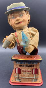 CHARLEY WEAVER BARTENDER Rosko Batt Op Vntg Toy: A vintage Rosko Japan Battery op CHARLEY WEAVER BARTENDER battery operated metal toy, circa 1960s collectible toy. Crafted from metal, fabric, and composite materials. Obverse reads CHARLEY WEAVER BAR