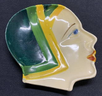 Sgn Art Deco Head of Woman Ceramic Trinket Dish: Ceramic trinket with head of a woman. Art Deco style. Trademarked to underside, illegible, hand painted. Made in Japan. Measures approx. 4.5 x 4.25 inches. Hairline crack, small chip and crazing obser