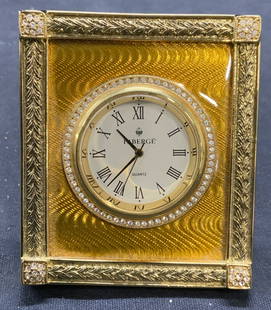 Faberge Guilloche Yellow Enamel Desk Clock: FABERGE Guilloche yellow enamel gold tone crystal decorated desk clock. Signed on clock face and underside. Measures approx. 2.75 x 2 3/8 inches, not tested for function. Some surface wear including s