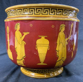 ROYAL DOULTON Greek Motif Ceramic Jardiniere: Underside is marked ROYAL DOULTON ENGLAND. Jardiniere has Greek motif detail depicting God & Goddess figures, flowers, leaves, & vases. Piece is footed. Base & rim has Greek Key pattern & gilt edge. V