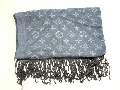 LOUIS VUITTON Reversible Fringe Scarf Shawl: Fringe scarf. Adorned in Louis Vuitton patterns in center. In a muted blue tone with fringe. Approx 66 inches by 26 inches. Soft hand.Moderate wearing to stitching.Louis Vuitton scarf, scarf fringe sc