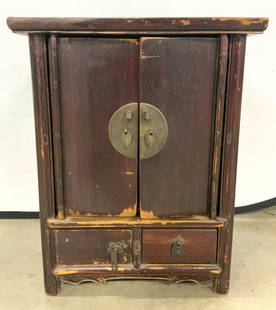 Antique Wood/Brass Hand Crafted Korean Cabinet: Cabinet is antique Korean. Piece is wooden, appears to be hand crafted. Interior has 2 wooden shelves. Lower area has 2 drawers, each with hand dovetailing. Cabinet has dark slate silver toned finish