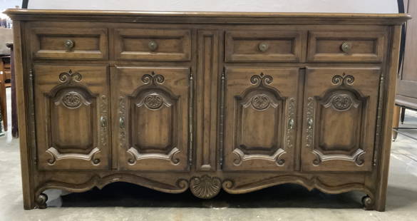 DREXEL HERITAGE Vintage Carved Wooden Buffet: Interior of top left drawer reads HERITAGE. Buffet is wooden. Piece is possibly vintage. Buffet has carved scroll, shell & other relief detail. Drawers have brass knob style handles & hand dovetailing