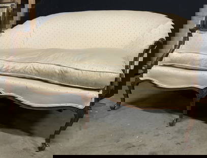 Vintage French Upholstered Settee Loveseat: Settee is vintage with carved wooden frame. Piece has cream toned upholstery with diamond shape pattern detail. Some edges of upholstery have double welting. Sofa measures approx 53 inches long 30 inc