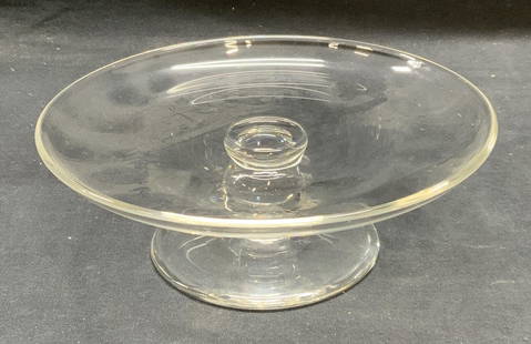 Steuben Art Glass Cake Stand: Steuben Art glass cake stand. Signed to underside. Measures approx. 7.5 x 2.5 inches. Some scratching observed. Steuben, Steuben cake stand, art glass, art glass cake stand, tableware, table accessori