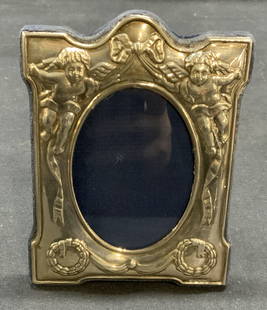 Vintage RC Sterling Silver Picture Frame: Vintage RC sterling silver picture frame with cherub motif. cherubs putti’s raised scrollwork, elements of Victorian design detailing, possibly period piece felt covered backing. Trademarked on fram