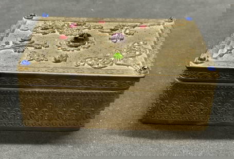 1920s E & JB Empire Art Gold Jewelry Box: 1920s E & JB Empire Art Gold jewelry box with crystal decoration, botanical and butterfly motif. Trademarked to underside. Measures approx. 4 x 3 x 1.25 inches. Surface wear including scratching and t