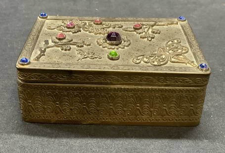 1920s E & JB Empire Art Gold Jewelry Box: 1920s E & JB Empire Art Gold jewelry box with crystal decoration, botanical and butterfly motif. Trademarked to underside. Measures approx. 4 x 3 x 1.25 inches. Surface wear including scratching and t