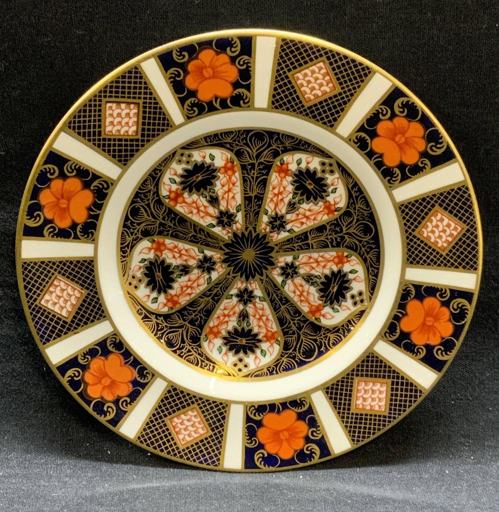 Royal Crown Derby Imari China Plate, England: Royal Crown Derby English bone china imari pattern plate. Trademarked to underside. Made in England. Measures approx. 6 inches diameter. Some surface wear including scratching observed. Royal crown de