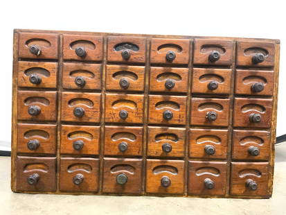 Vntg Wooden Apothecary Chest Cabinet 30 Drawer 2ft: Chest is vintage possibly antique. Piece is brown toned and wooden. Chest of drawer has 30 drawers each with wooden knob handle. Piece measures approx 23 inches long 14 inches tall 10 inches deep. Che