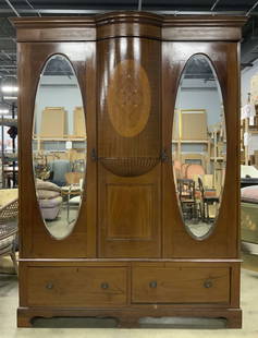 Vntg Wooden Victorian Marquetry Wardrobe W Mirrors: Wardrobe is vintage and wooden. Piece is possibly mahogany. Wardrobe has inlaid marquetry parquetry detail. Piece has 2 panel drawers with ellipse shaped beveled mirrors. Lower area has 2 drawers each