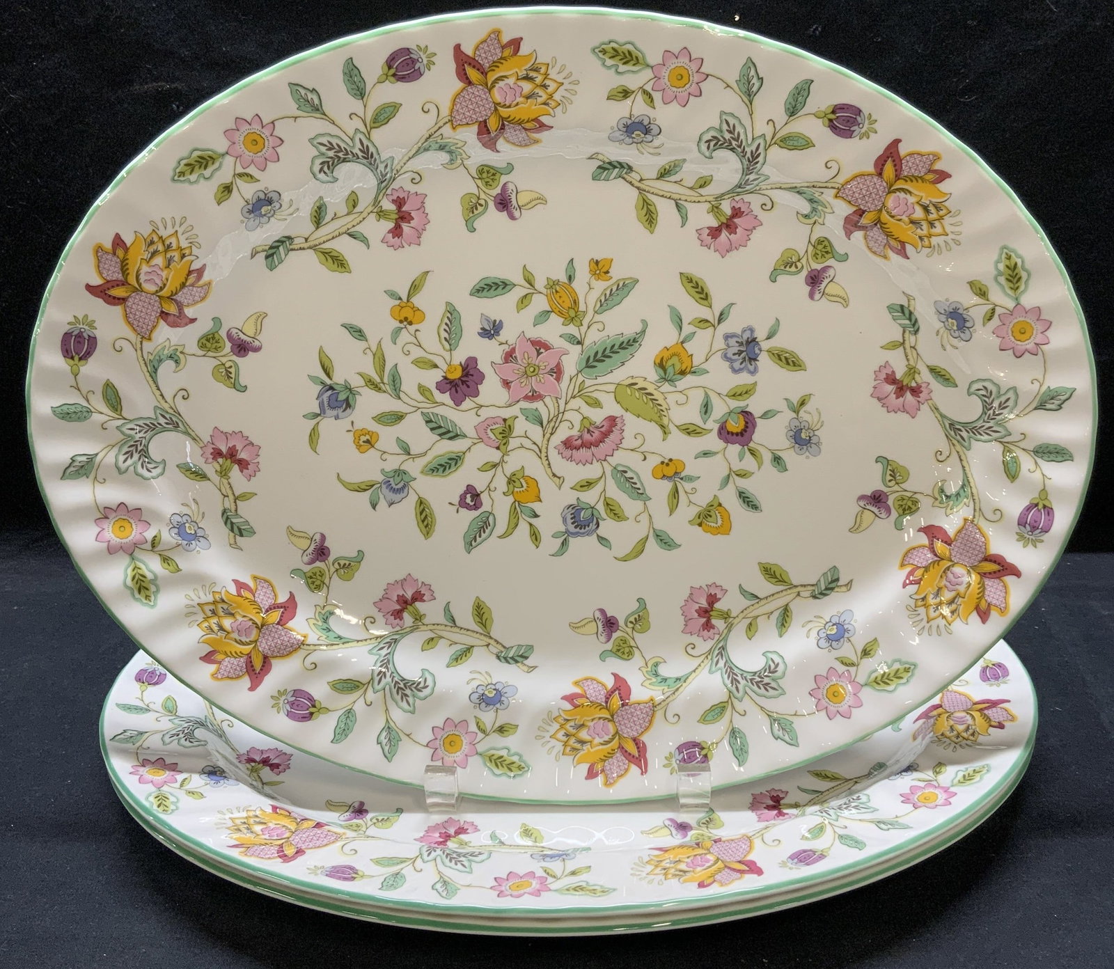 Lot 3 Minton Haddon Hall China Platters, England: Lot of 3 Minton English bone china platters in Haddon Hall pattern. All pieces trademarked to undersides. Made in England. Measure approx. 16.25 x 12.25 inches each. All pieces have some surface wear 
