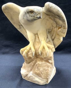 Vntg Carved Marble Eagle Sculpture: Vintage eagle sculpture made of carved off white marble with black veins throughout. Depicts the eagle perched on a stone. Approx 10 inches tall and 10 inches wide. Heavy weight. Evident loss to marbl