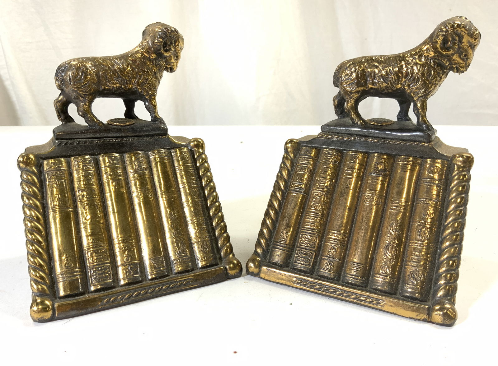 FORDHAM UNIVERSITY Vtg Pr Gilt Iron Ram Bookends: Emblem underneath ram figures read FORDHAMENSIS UNIVERSITAS. Bookends appear to be vintage Each bookend appears to be gilt iron, possibly gilt bronze. Each depicts a Ram figure standing on top of a bo