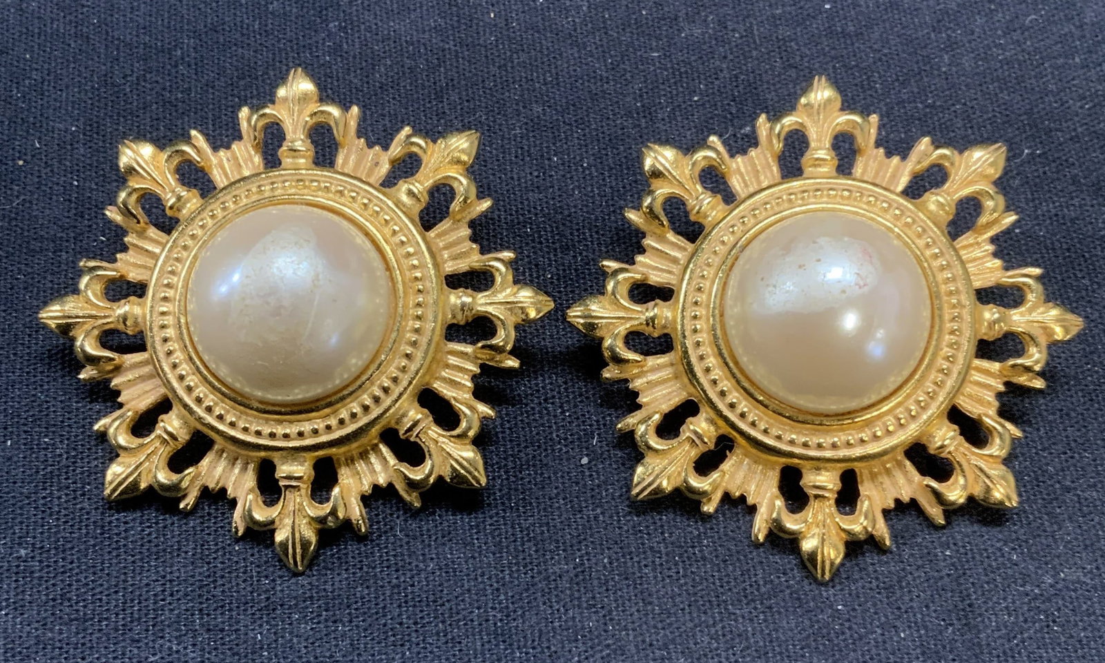 BEN AMUN Gold Pl Faux Pearl Statement Earrings: Vintage Ben Amun gold plated faux pearl clip on earrings. Signed to underside. Measure approx. 2 inches diameter. Some scratching observed. Property of Manhattan estates and fashion industry executive
