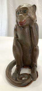 Painted Cast Iron Monkey Doorstop: Cast iron monkey door stop, painted brown, felt on underside , possibly an antique. Can also be used as a book end. 8.5 in. Ht. 6.75 in. Depth, 4.25 in. Wide. Appears to have mended legs with glue., M