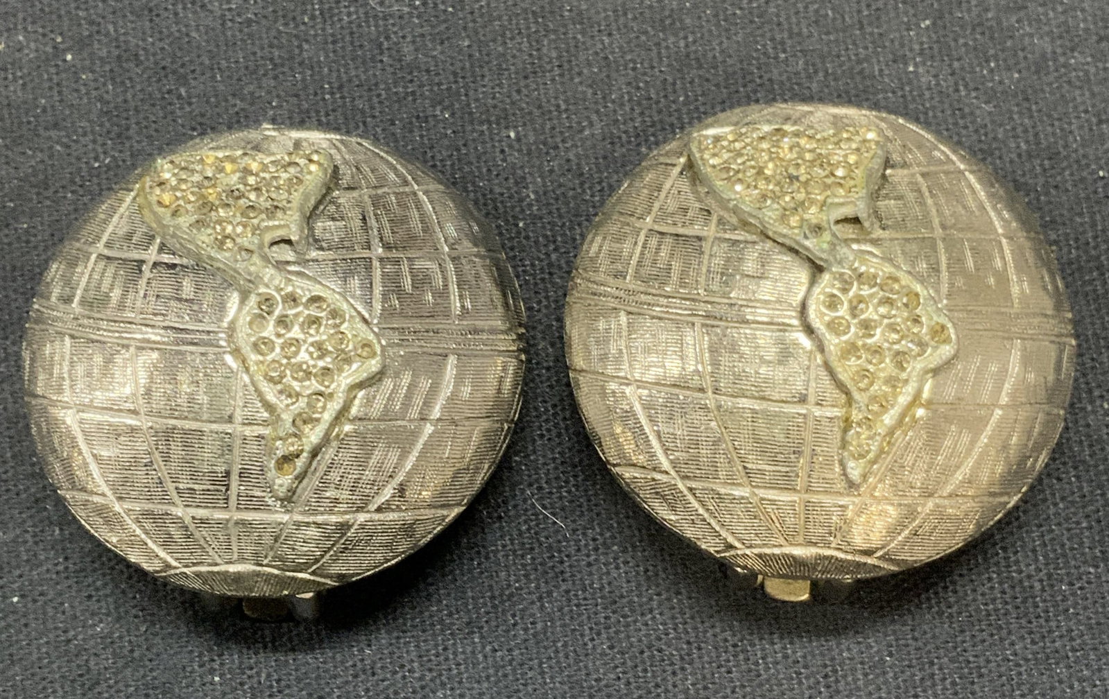 MARLA BUCK Silver Tone Crystal Globe Earrings: Vintage Marla Buck silver tone crystal decorated globe motif earrings. Signed to underside. Measure approx. 1.25 inches diameter. Some scratching observed. Some crystals need replacement. Property of 