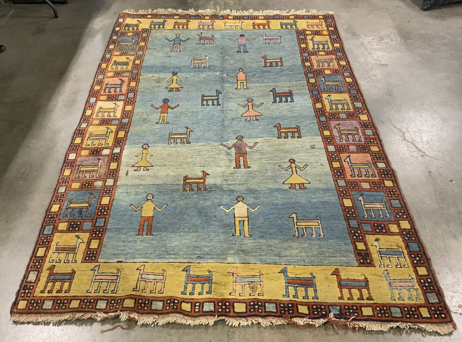 Antq Handmade Afghan Rm Sz Wool Rug: Rug is handmade and wool. Piece is vintage possibly antique. Rug is Afghan. Piece has intricate multi toned floral motif detail. Rug is Room sized. Edges have short cream toned fringes. Rug measures a