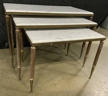 Set 3 Vintage Brass & Metal Nesting Tables: Lot includes 3 tables. Each are vintage possibly antique. Tables have white toned marble tops & brass legs. Largest table measures 26 inches long 17 inches tall 14 inches deep. Nesting tables, marble