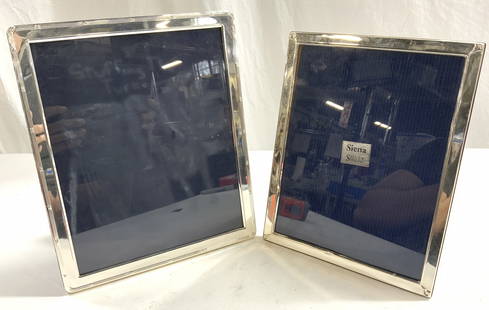 Sterling Silver SIENA Lot 2 Picture Frames: One picture frame is sterling silver & trademarked SIENA. One Frame has navy toned felt backside (unmarked). One frame has wood style backside. Larger 2 frame measures approximately 11.25 inches tall