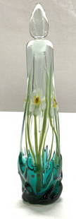 Singed Art Glass Nouveau Perfume bottle w Stopper: Daffodil Art glass perfume bottle with bottle stopper / perfume tube. This is signed by artist on verso, covered by felt . Embossed bottle, lovely emerald green glass fade to clear with daffodils in r