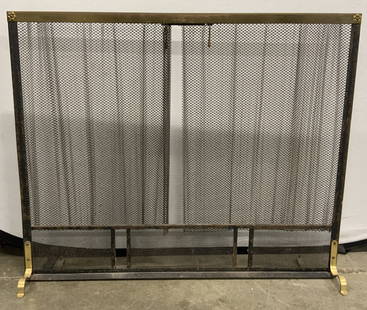 Vintage Footed Chainmail Fireplace Screen: A vintage fireplace screen crafted from metal. Chainmail style curtain, both sides are adjustable. Floral accents to the top corners. Brass hued curved feet to the base. Measures approx. 38W x 31.25H