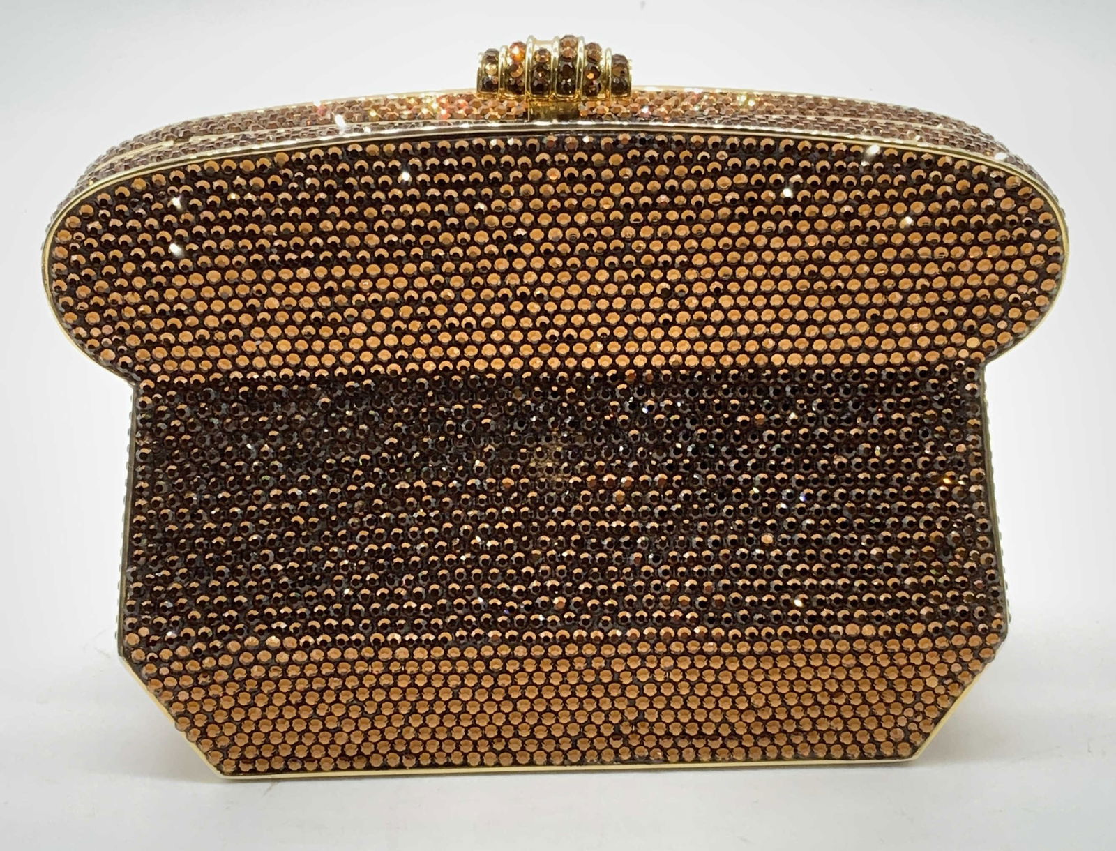 Judith Leiber Etruscan Bronze Crystal Minaudiere: Judith Leiber Etruscan bronze Swarovski crystal minaudiere. Gold tone chain strap. Designer label to interior. Some crystal on push clasp need replacement, some scratching to interior leather lining a