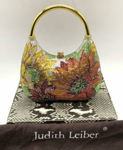 JUDITH LEIBER Ltd Edt Crystal Sunflower Handbag: Judith Leiber limited edition crystal sunflower minaudiere handbag. Designer label to interior metal plaque. Measures approx. 6 x 2.5 x 6.5 inches including handle. Some scratching to exterior observe