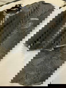 CHANEL Wool & Cotton Tweed Jacket, France: Black CHANEL Jacket with manmade leather trim. Chanel label is Black with white lettering. Size 44. Classic CHANEL boxy shape, no hardware, Jacket closes with 4 hook and loop clasps. 1 CHANEL interloc
