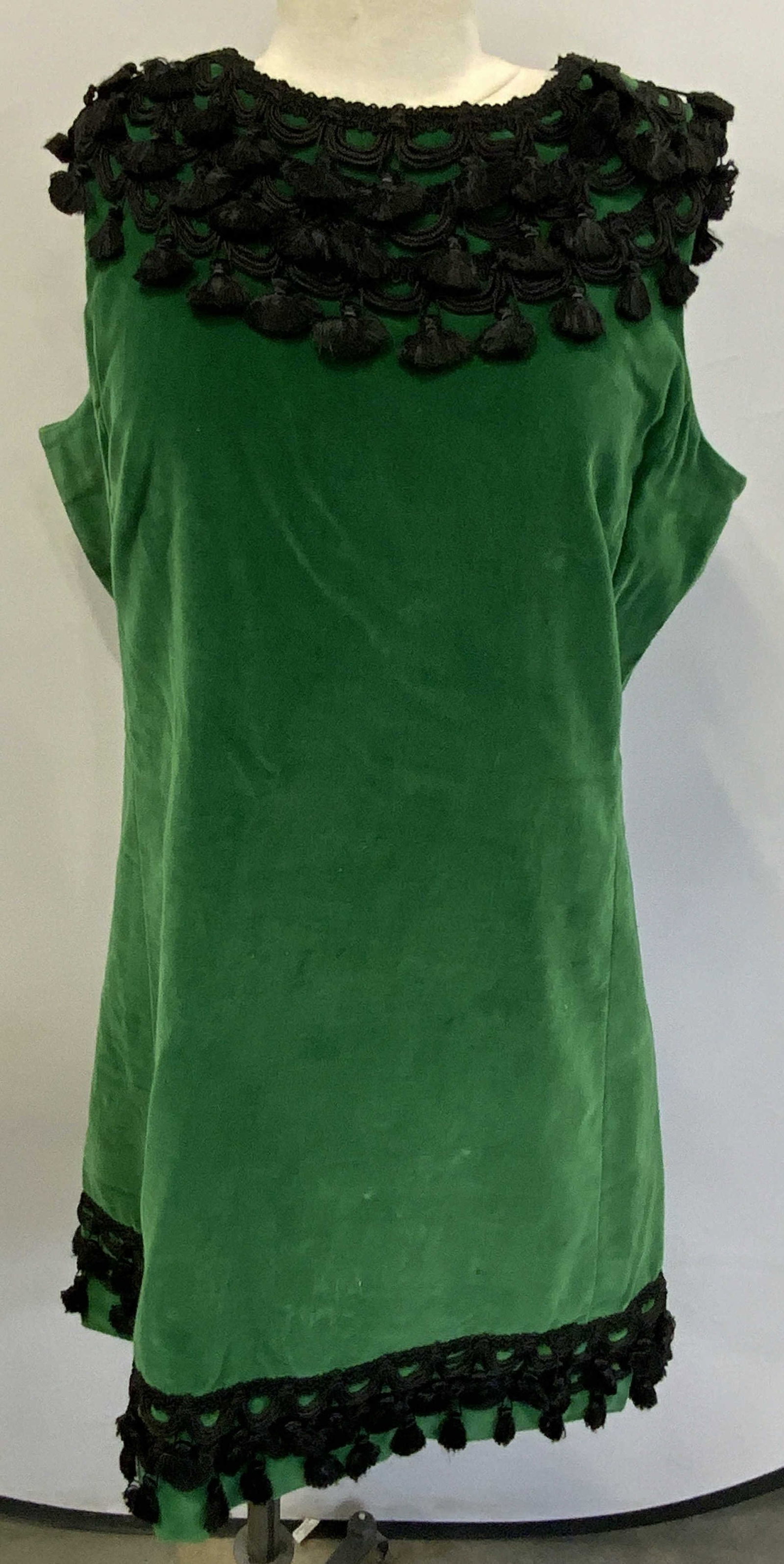 The Lilly Green Velvet Sleeveless Shift Dress: The Lilly green velvet sleeveless shift dress. Measures approx. 20.5 inches across chest, 36 inches from shoulder to hem. Some wear to material consistent with exposure. Property of Manhattan estates 