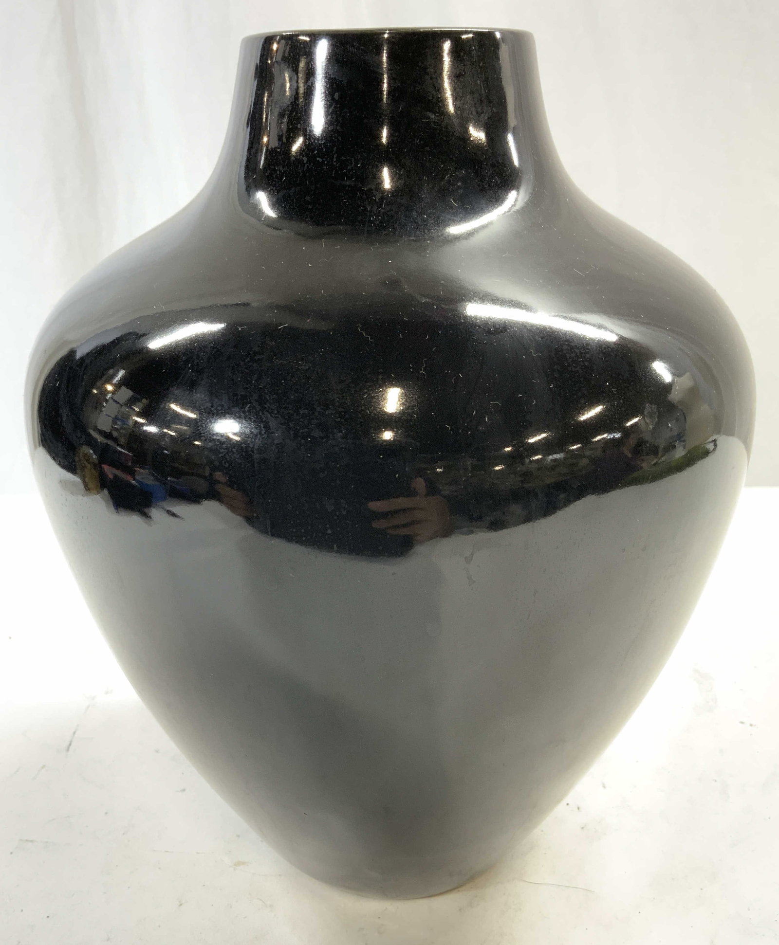 Porcelain Tabletop Vase Vessel Black: Vase is black toned and porcelain. Vase has narrow mouth. Piece measures approx 9.5 inches tall 7 inches wide. Vase, porcelain vase, black vase, home decor, decorative tabletop, tabletop decor. Proper