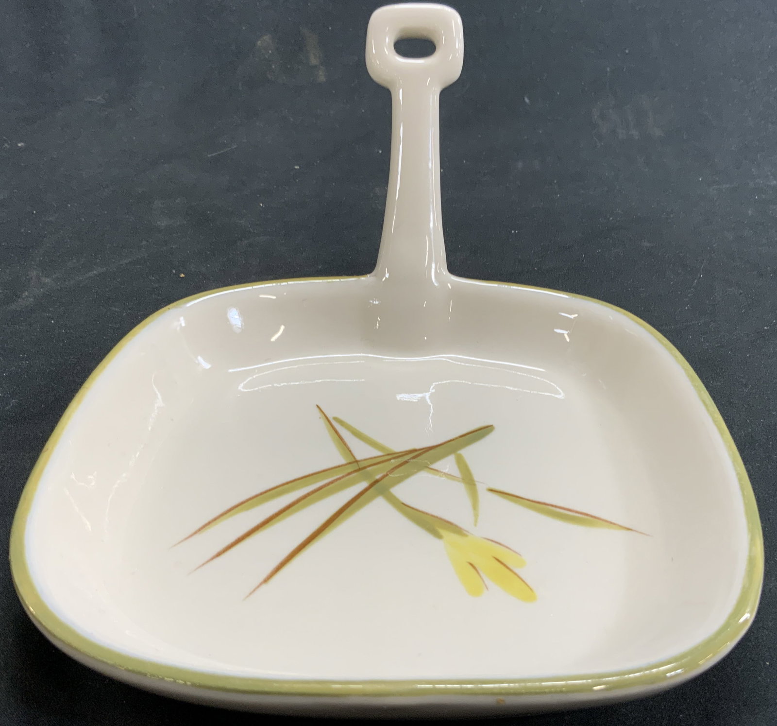 WINFIELD WARE Hand Crafted Porc Skillet Plate: Appears to be vintage. Underside is marked WINFIELD WARE HAND CRAFT China Santa Monica Calif. Skillet plate is porcelain. Piece has handle on one side. Center has floral and leaf detail, tiger iris il