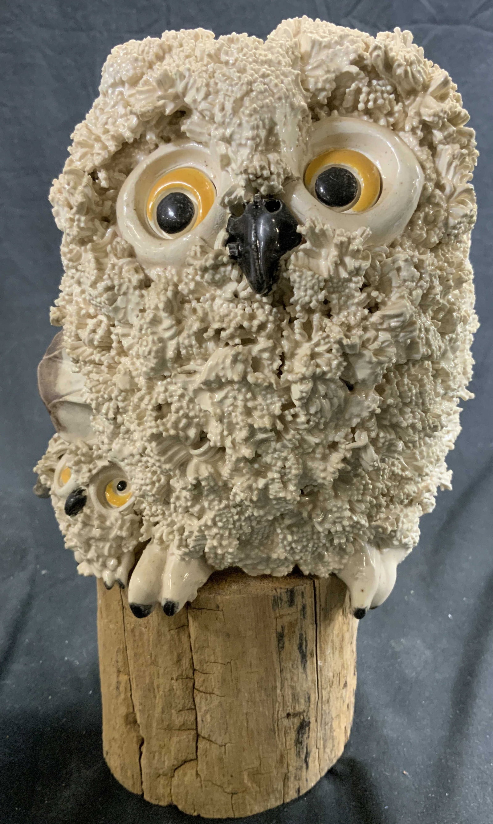 Vintage Porcelain Owl On Wood Base: Owl figure is vintage and porcelain. Depict an owl and baby owl. Piece stands on wooden base. Measures approx 9 inches tall 5 inches wide & deep. Evident chips & wear. Property of Manhattan estates an