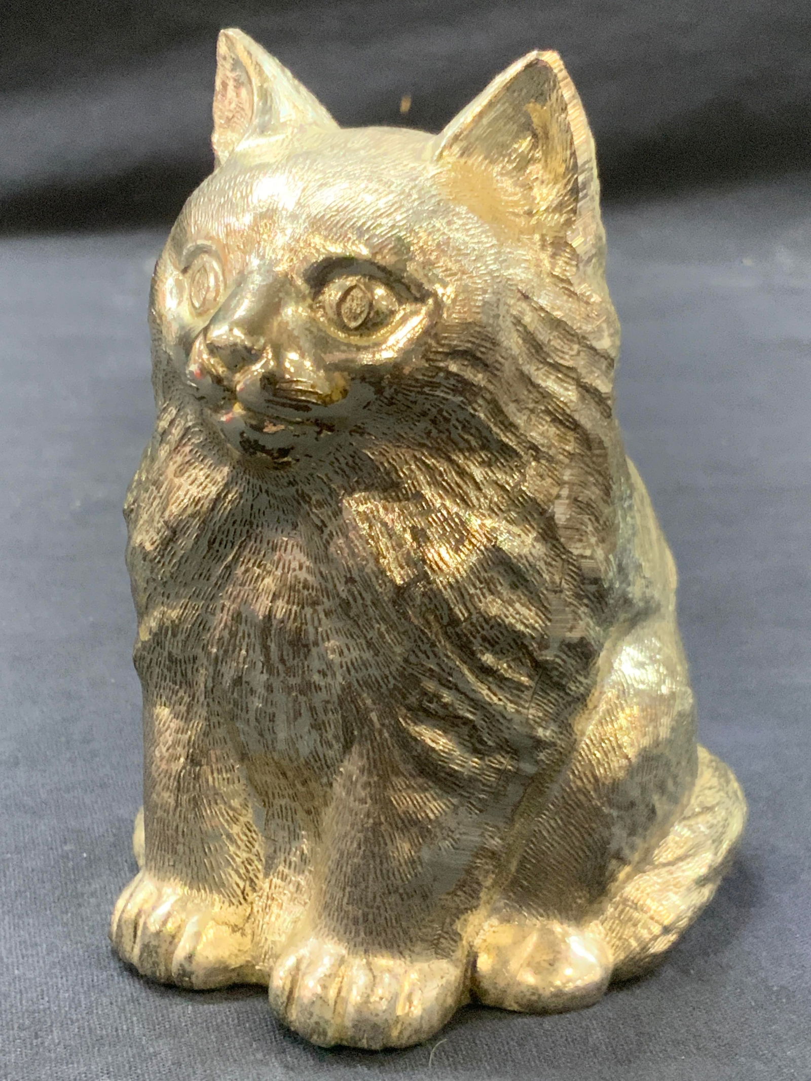 Vntg Bridalane Cast Metal Cat Coin Bank, Japan: Vintage cast metal cat coin bank with coin slot on the back of the cat. Marked in underside, Bridalane, Japan Approx 4.75 inches tall and 3.75 inches long. Moderate wearing to metal throughout, unders
