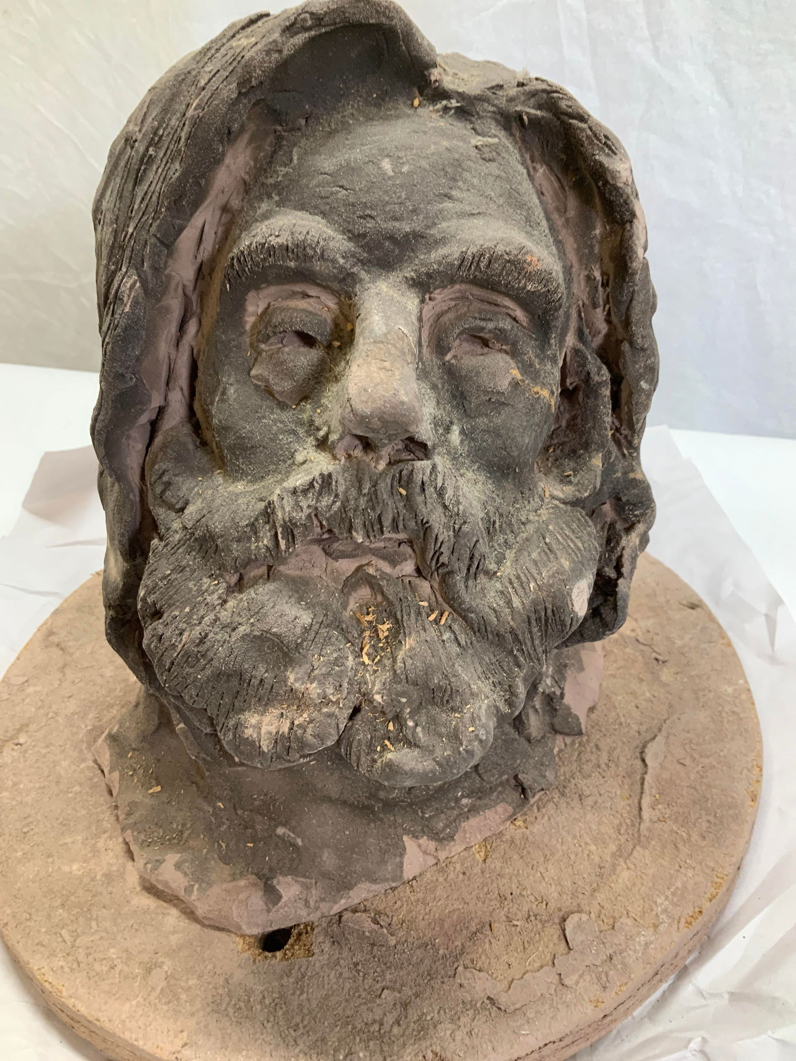 Moses Bust Clay Sculpture 11inH: Hand sculptured Moses Head Bust made of clay with a dark finish. Intricate facial detail - eyes, nose, beard , etc. base in clay coated over sawdust. Bust is very heavy, measures 11 in ht. , 8.75 in.