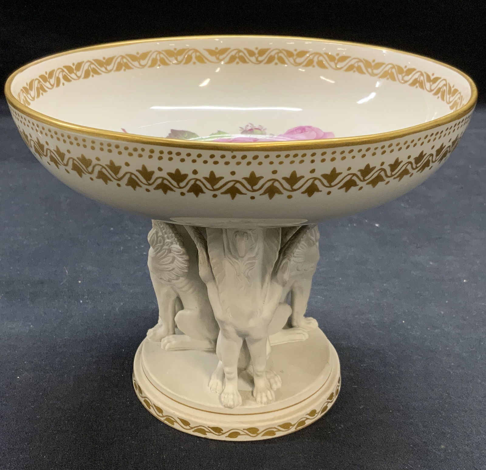 Style of KPM Berlin Porc Griffin Pedestal Bowl: Style of KPM Berlin porcelain pedestal bowl with griffin decoration and floral motif. Gilt border. Marked 1447 to underside, additional marks illegible. Measures approx. 6.75 x 5.5 inches. Some surfac