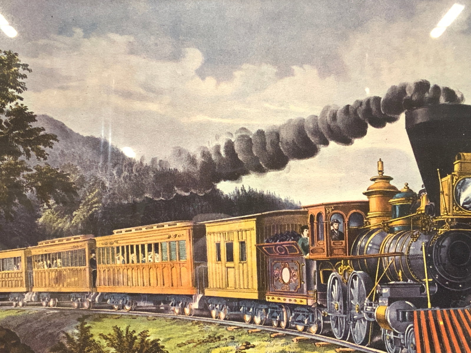 Framed Colored American Express Train Lithograph: Framed colored lithograph depicting the American Express train. Framed in a wooden frame with gilt inner fillet and white mat board. Approx 16 x 17 inches window measures 7 x 9 inches. Moderate wearin
