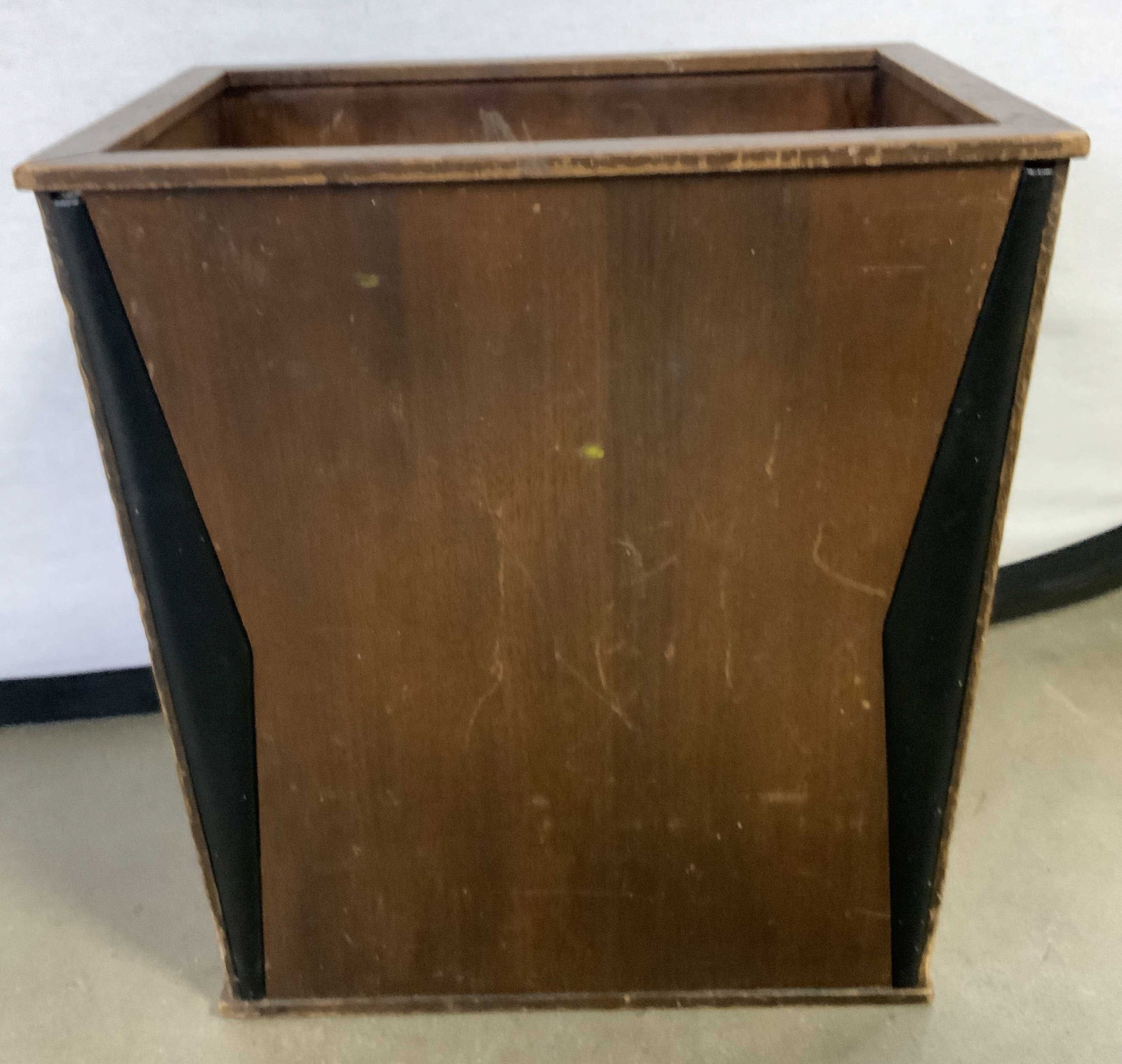 SCHEIBE Vintage Wooden Vessel: A vintage wooden vessel / receptacle. Brown hued wood finish throughout, obverse features raised black leather style material accents. Sticker to underside reads THIS IS A GENUINE SCHEIBE PRODUCT, MAK
